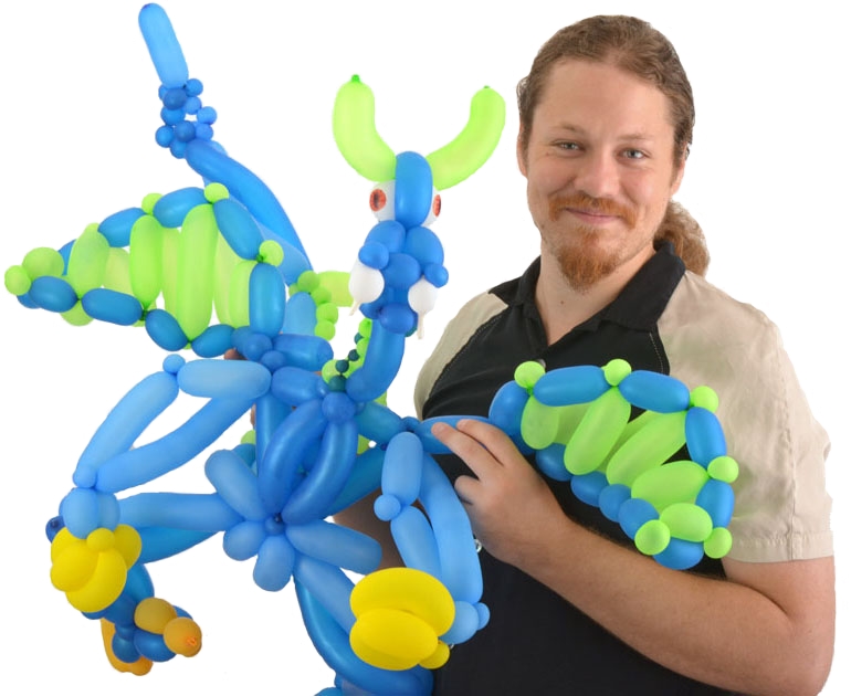 Dan holding a balloon dragon